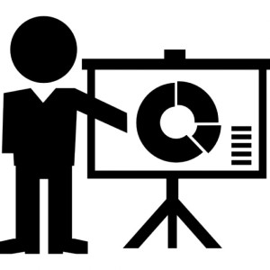 instructor-giving-a-lecture-with-circular-graphic-on-screen_318-58962